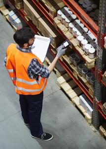 man scanning products in warehouse - 156865769